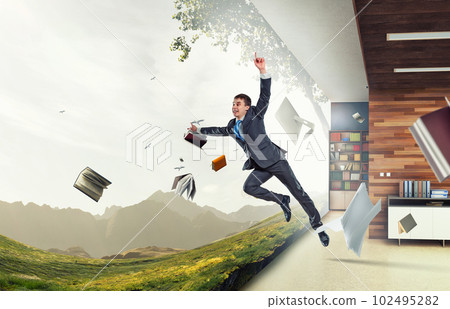 Happy businessman jumping high . Mixed media Happy businessman jumping high . Mixed media 102495282