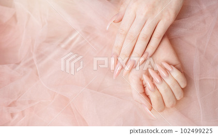 Elegant pastel pink natural manicure. 102499225