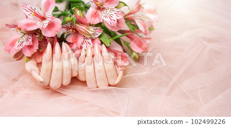 Elegant pastel pink natural manicure. 102499226