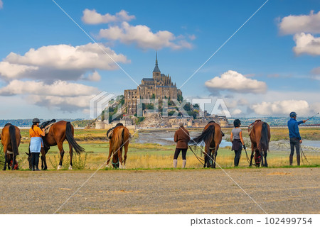 Horses and tourists with famous Le Mont Saint-Michel in Normandy, France Horses and tourists with famous Le Mont Saint-Michel in Normandy, France 102499754