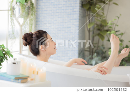 Female beauty Young woman taking a bath Female beauty Young woman taking a bath 102501382