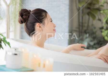 Female beauty Young woman taking a bath Female beauty Young woman taking a bath 102501405