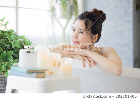 Female beauty Young woman taking a bath Female beauty Young woman taking a bath 102501406