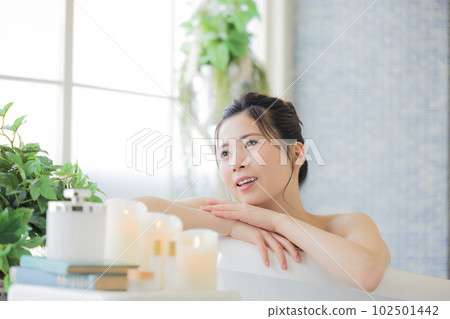 Female beauty Young woman taking a bath Female beauty Young woman taking a bath 102501442