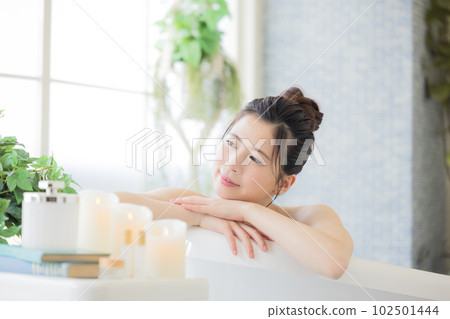 Female beauty Young woman taking a bath Female beauty Young woman taking a bath 102501444