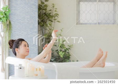Female beauty Young woman taking a bath Female beauty Young woman taking a bath 102501450
