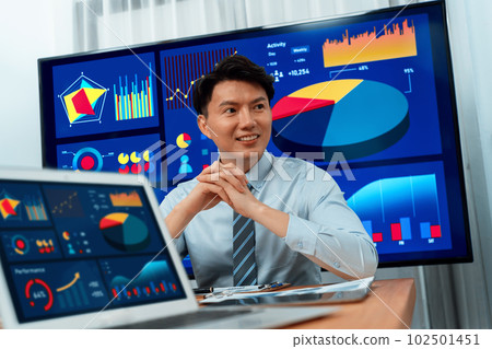 Portrait of male manager in harmony office with businesspeople in background. 102501451