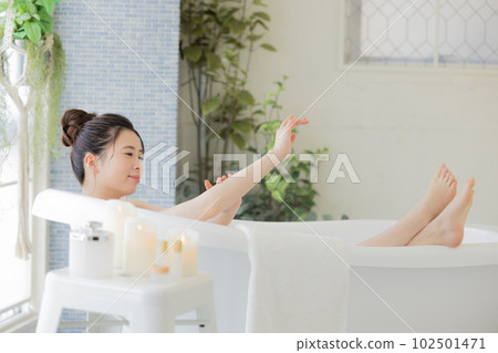 Female beauty Young woman taking a bath Female beauty Young woman taking a bath 102501471