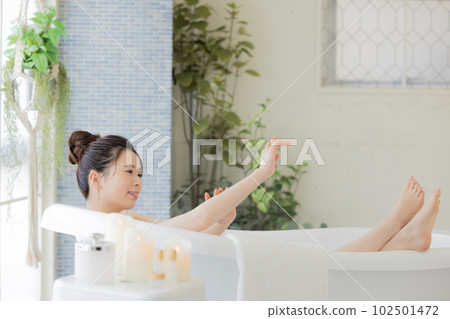 Female beauty Young woman taking a bath Female beauty Young woman taking a bath 102501472