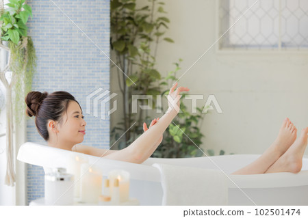 Female beauty Young woman taking a bath Female beauty Young woman taking a bath 102501474