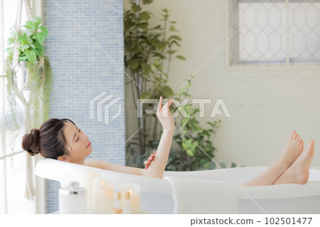 Female beauty Young woman taking a bath Female beauty Young woman taking a bath 102501477