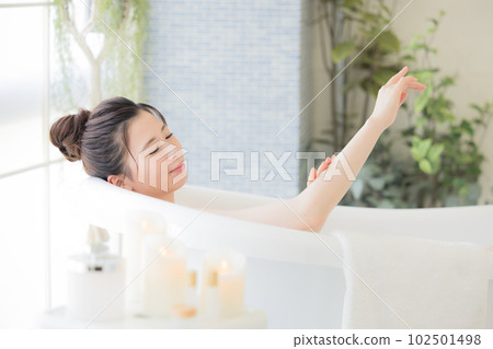 Female beauty Young woman taking a bath Female beauty Young woman taking a bath 102501498