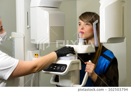 X-ray technician makes CT scan of jaw X-ray technician makes CT scan of jaw 102503794