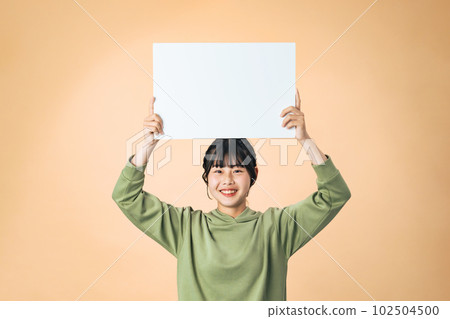girl showing a message board girl showing a message board 102504500