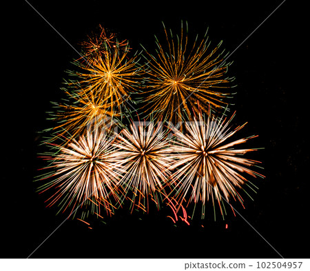 Multiple fireworks against the deep black sky. Bright  display of the fireworks 102504957