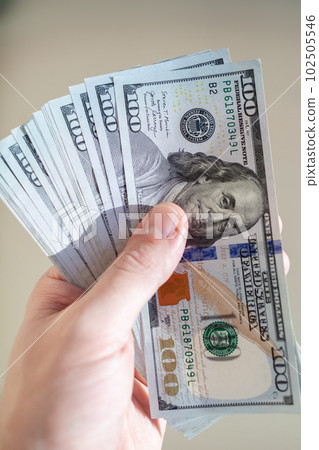 Close up male hand Counting and holding money us dollar. Close up male hand Counting and holding money us dollar. 102505546