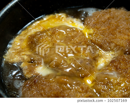 Katsutoji cooking scene. Boil pork cutlet (pork fillet) with egg. Katsutoji cooking scene. Boil pork cutlet (pork fillet) with egg. 102507169