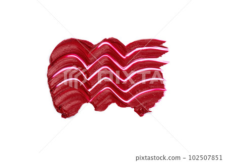 Red lipstick swatch isolated on white background. Brush stroke of lipstick or wet eye shadow for design. Red lipstick swatch isolated on white background. Brush stroke of lipstick or wet eye shadow for design. 102507851