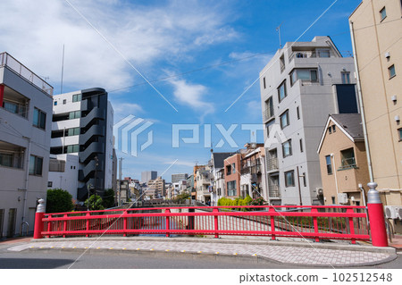 Yayoi-cho, Nakano-ku, Tokyo, a residential area along the Kanda River and Nakano Shimbashi with its vivid vermillion colors 102512548
