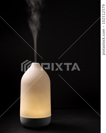 Diffuser diffusing steam on black background 102512579