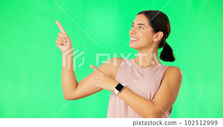 Woman face, hands pointing and green screen with happiness and smile showing advertisement. Portrait, isolated and studio background with a happy young female point to show mock up announcement 102512999