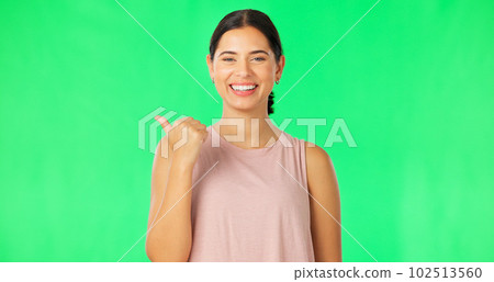 Woman face, pointing and green screen with happiness and smile showing mockup for advertisement. Portrait, isolated and studio background with a happy young female point to show mock up announcement Woman face, pointing and green screen with happiness and smile showing mockup for advertisement. Portrait, isolated and studio background with a happy young female point to show mock up announcement 102513560