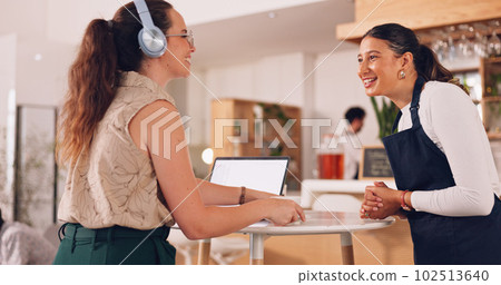 Barista helping customer, woman giving order to barista. Smiling customer getting coffee. Barista helping customer, woman giving order to barista. Smiling customer getting coffee. 102513640
