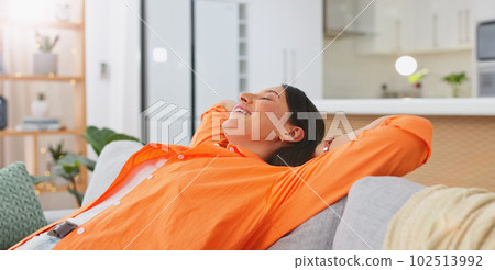 Woman, relax and hands behind head on sofa, living room and lounge for happiness, calm mind and easy lifestyle at home. Happy young female in peace on couch, smile and zen mental health for self care Woman, relax and hands behind head on sofa, living room and lounge for happiness, calm mind and easy lifestyle at home. Happy young female in peace on couch, smile and zen mental health for self care 102513992