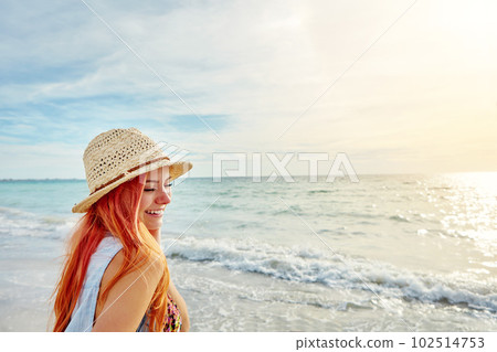 Its hard not to be happy at the beach. Shot an attractive young woman enjoying a day at the beach. Its hard not to be happy at the beach. Shot an attractive young woman enjoying a day at the beach. 102514753