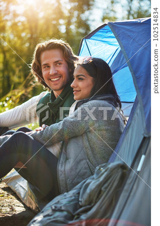 I knew shed love camping. an adventurous young couple at their campsite. 102514834