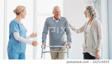 With support, progress is always possible. a senior man using a walker with the assistance of his wife and young nurse. With support, progress is always possible. a senior man using a walker with the assistance of his wife and young nurse. 102514835