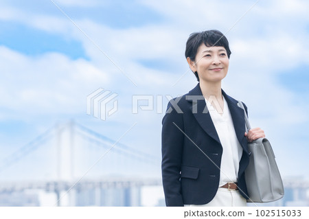 Portrait of a female manager in her 50s wearing a jacket Portrait of a female manager in her 50s wearing a jacket 102515033