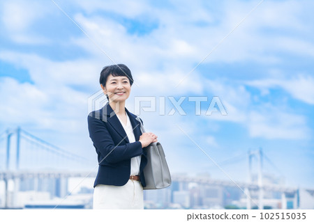 Portrait of a female manager in her 50s wearing a jacket Portrait of a female manager in her 50s wearing a jacket 102515035
