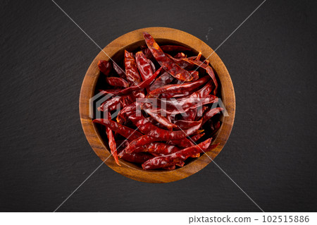 dried chili on stone background dried chili on stone background 102515886