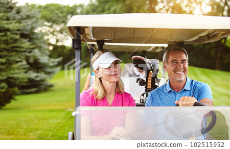 Theyre on course for a good time. an affectionate mature couple spending a day on the golf course. Theyre on course for a good time. an affectionate mature couple spending a day on the golf course. 102515952