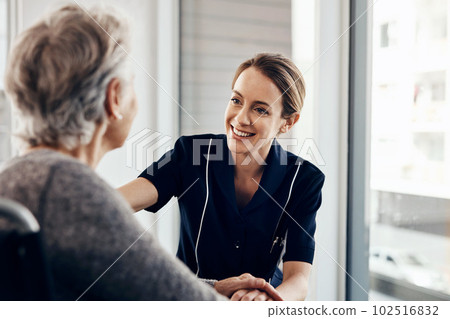 Do you need anything. a female nurse caring for a senior woman in a wheelchair. Do you need anything. a female nurse caring for a senior woman in a wheelchair. 102516832