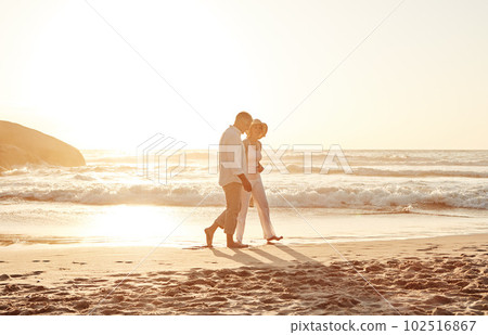 Romance never gets old. Full length shot of an affectionate middle aged couple walking hand in hand along the beach at sunset. Romance never gets old. Full length shot of an affectionate middle aged couple walking hand in hand along the beach at sunset. 102516867
