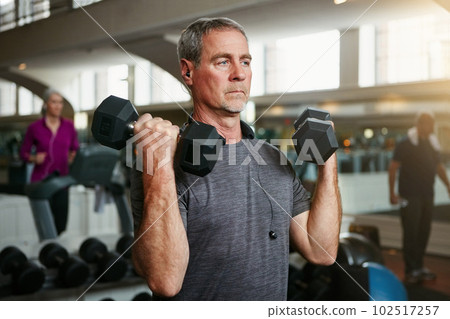 Youre never too old to lift. a senior man working out with weights at the gym. Youre never too old to lift. a senior man working out with weights at the gym. 102517257