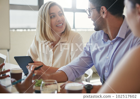 Collaboration is what excites them. a team of business colleagues discussing a project around a table in their office. Collaboration is what excites them. a team of business colleagues discussing a project around a table in their office. 102517602