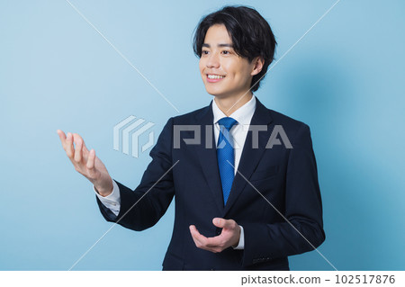 A young man in a suit A young man in a suit 102517876