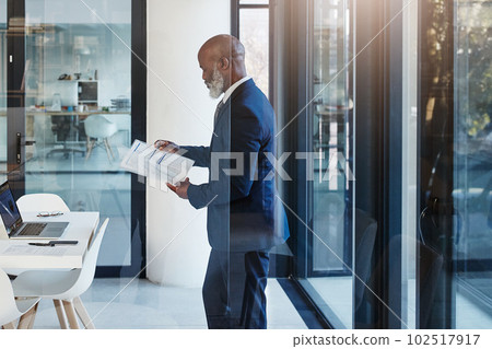 Everything goes through me in my company. a mature businessman working in a modern office. Everything goes through me in my company. a mature businessman working in a modern office. 102517917