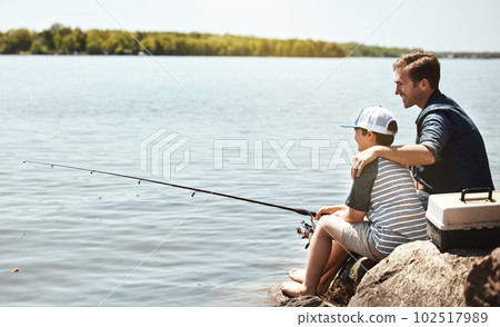 Enjoying their first fishing adventure together. a father and his little son fishing together. Enjoying their first fishing adventure together. a father and his little son fishing together. 102517989