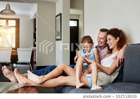 Home is where theyre happiest. a happy family relaxing together at home. Home is where theyre happiest. a happy family relaxing together at home. 102518010
