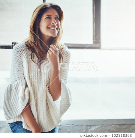 The weekend is here and my worries are all gone. an attractive young woman relaxing at home. The weekend is here and my worries are all gone. an attractive young woman relaxing at home. 102518398