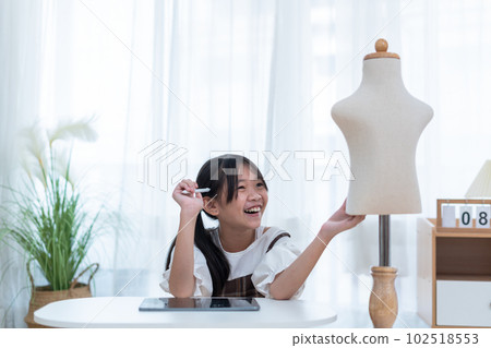 Little girl, little fashion designer or tailor and mannequin Little girl, little fashion designer or tailor and mannequin 102518553