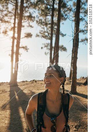 Some experiences bring about a new way of seeing things. a young woman out on a hike in the forest. Some experiences bring about a new way of seeing things. a young woman out on a hike in the forest. 102518718