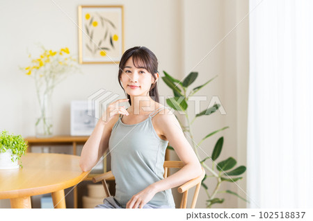 A young lady in the dining room A young lady in the dining room 102518837