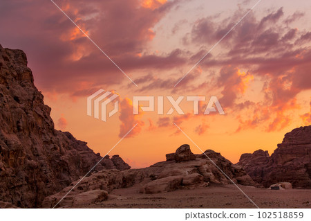 colorful sunset sky, rocks in Little Petra, Jordan 102518859