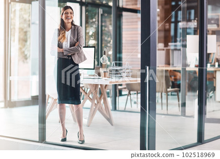 Driven daily to be a success. a confident young businesswoman working in a modern office. Driven daily to be a success. a confident young businesswoman working in a modern office. 102518969