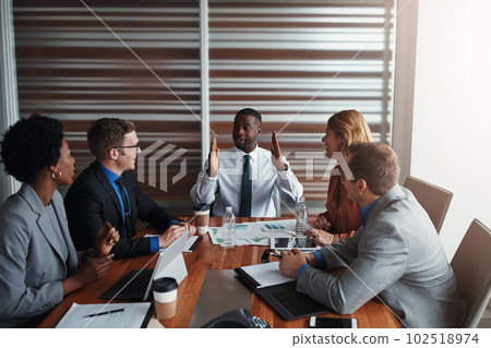 This is how we will maintain a healthy profit margin. a group of businesspeople having a meeting in an office. 102518974